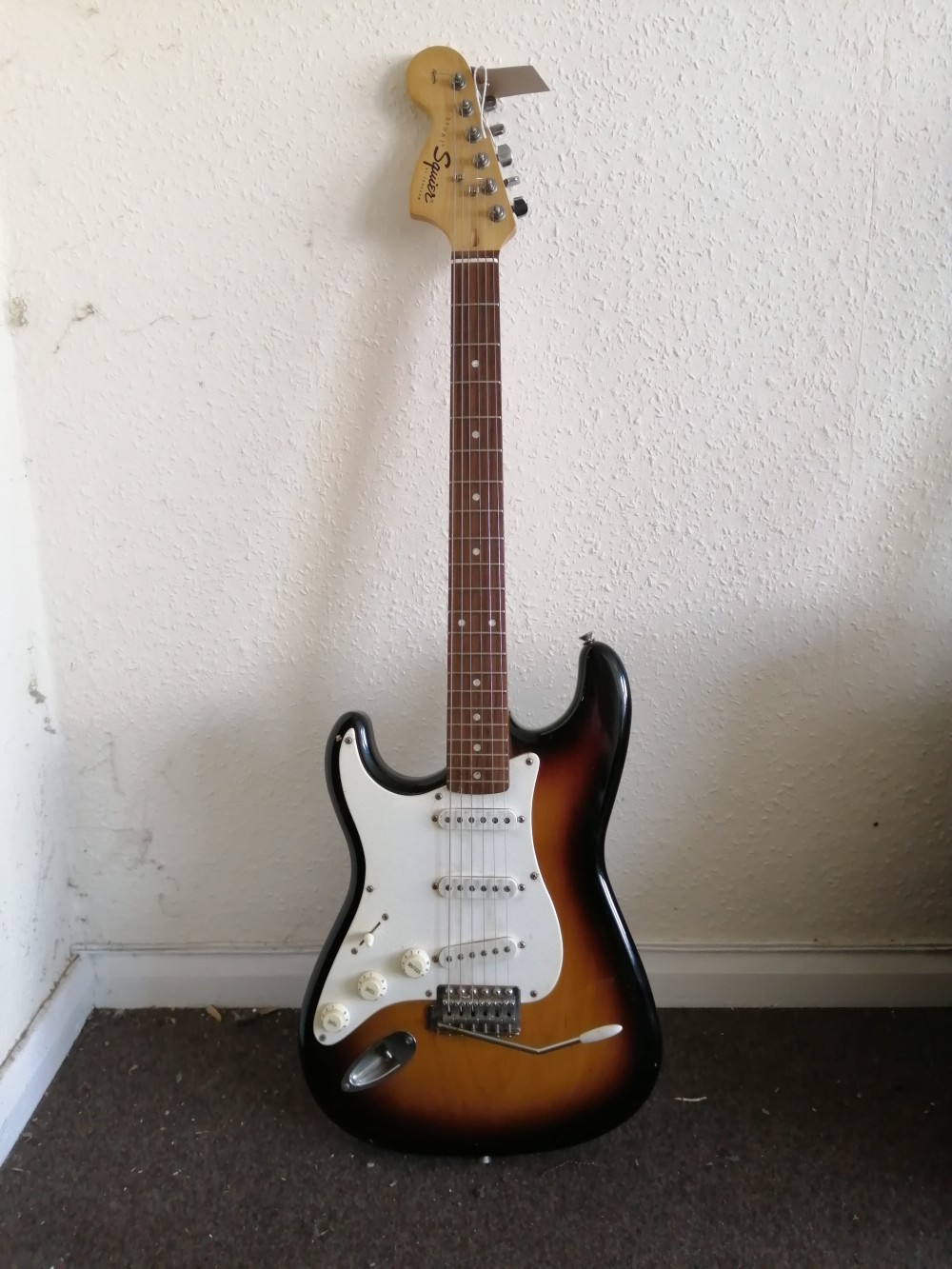 A left handed Squier Strat Affinity Series electric guitar